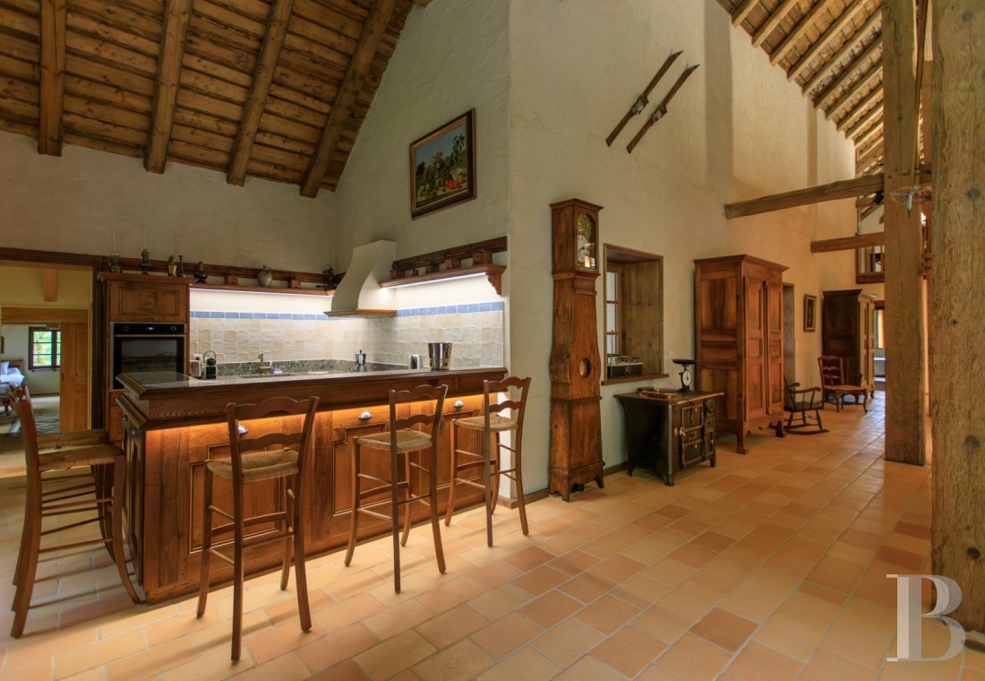 A former livestock farm which has been transformed into a vast, comfortable home near to Nantua in the Haut-Bugey region - photo  n°21